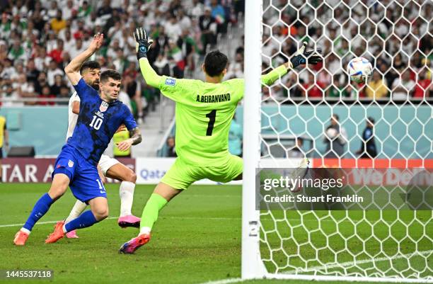 Christian Pulisic of United States scores their team's first goal past Alireza Beiranvand of IR Iran during the FIFA World Cup Qatar 2022 Group B...