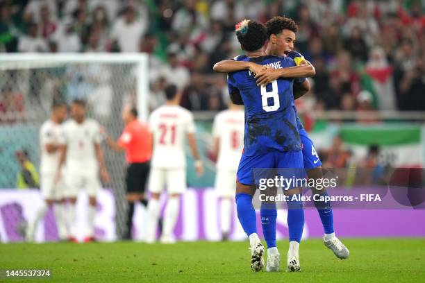 Weston McKennie and Tyler Adams of United States celebrate after Christian Pulisic of United States scored their side's first goal during the FIFA...