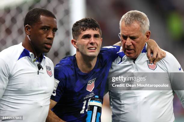 Christian Pulisic of United States receives medical treatment after scoring their sides first goal during the FIFA World Cup Qatar 2022 Group B match...