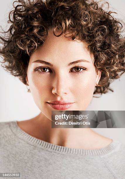 beauty portrait of curly brunette woman - beauty curl stockfoto's en -beelden