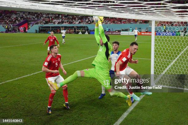 Danny Ward of Wales makes a save during the FIFA World Cup Qatar 2022 Group B match between Wales and England at Ahmad Bin Ali Stadium on November...