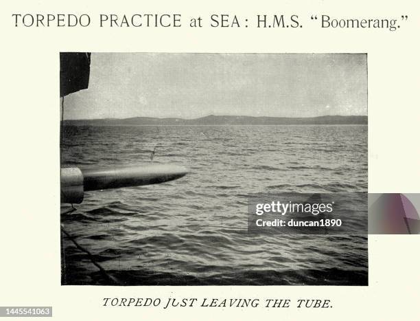 torpedo just leaving the tube, hms boomerang, royal navy warship, 1890s, victorian vinatge photograph - torpedo stock illustrations