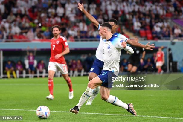 Phil Foden of England scores their team’s second goal during the FIFA World Cup Qatar 2022 Group B match between Wales and England at Ahmad Bin Ali...