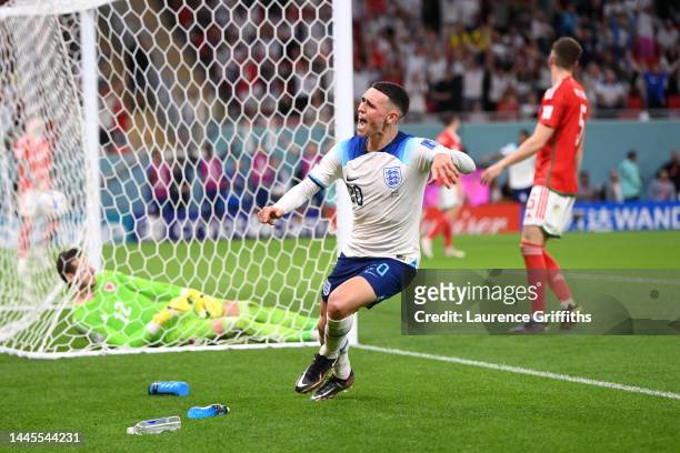 Phil Foden of England celebrates after scoring their team's second goal during the FIFA World Cup Qatar 2022 Group B match between Wales and England...