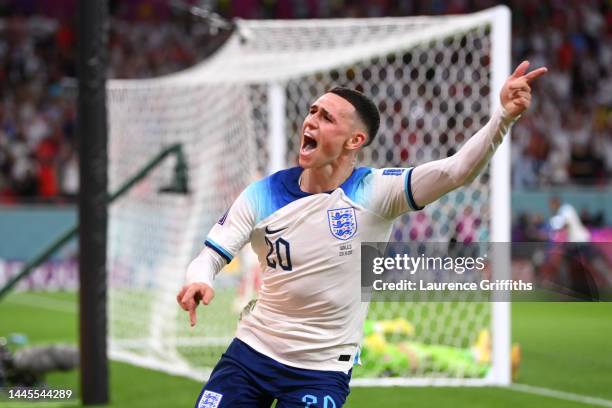 Phil Foden of England celebrates after scoring their team's second goal during the FIFA World Cup Qatar 2022 Group B match between Wales and England...