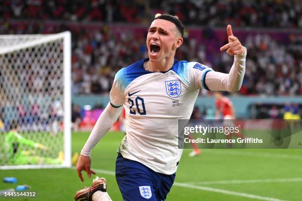 Phil Foden of England celebrates after scoring their team's second goal during the FIFA World Cup Qatar 2022 Group B match between Wales and England...