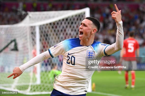 Phil Foden of England celebrates after scoring their team's second goal during the FIFA World Cup Qatar 2022 Group B match between Wales and England...