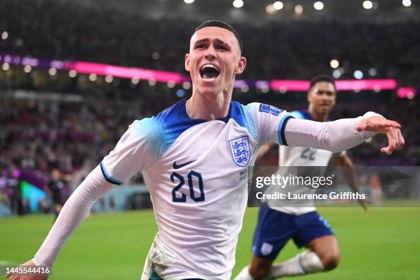 Phil Foden of England celebrates after scoring their team's second goal during the FIFA World Cup Qatar 2022 Group B match between Wales and England...