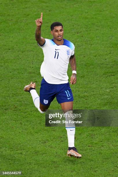 Marcus Rashford of England celebrates after scoring their team's first goal during the FIFA World Cup Qatar 2022 Group B match between Wales and...