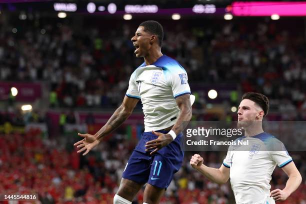 Marcus Rashford of England celebrates after scoring their team's first goal during the FIFA World Cup Qatar 2022 Group B match between Wales and...