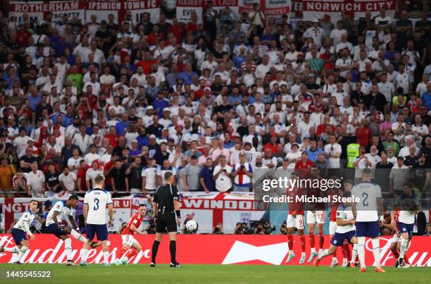 Marcus Rashford of England scores their team's first goal off a free kick during the FIFA World Cup Qatar 2022 Group B match between Wales and...
