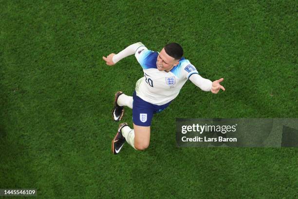 Phil Foden of England celebrates with teammates after scoring their team's second goal during the FIFA World Cup Qatar 2022 Group B match between...