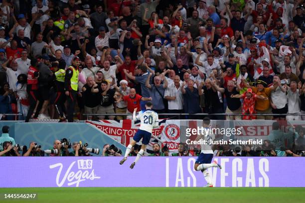 Phil Foden of England celebrates with teammates after scoring their team's second goal during the FIFA World Cup Qatar 2022 Group B match between...