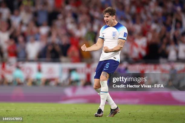 John Stones of England celebrates after their third goal by Marcus Rashford during the FIFA World Cup Qatar 2022 Group B match between Wales and...