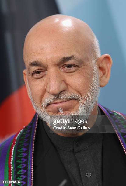 Afghan President Hamid Karzai speaks to the media after signing agreements with German Chancellor Angela Merkel on the future role of Germany in...