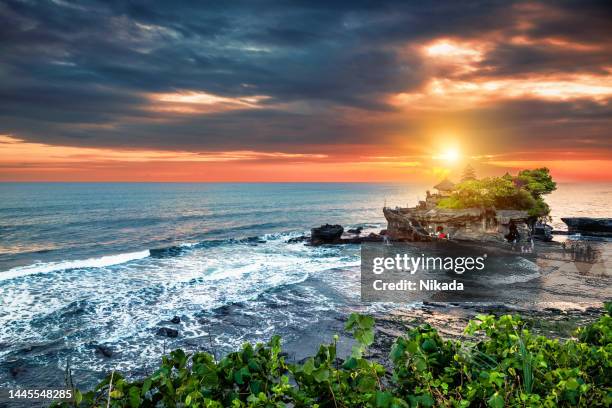 tanah lot hindu temple in bali at sunset - bali bildbanksfoton och bilder