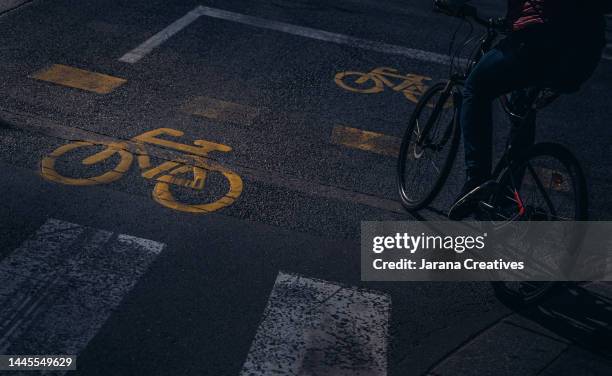 unrecognisable person riding his bicycle along a cycle lane.
road sign in the shape of a bicycle
road sign in the shape of a bicycle
road sign in the shape of a bicycle - school hungary stock pictures, royalty-free photos & images