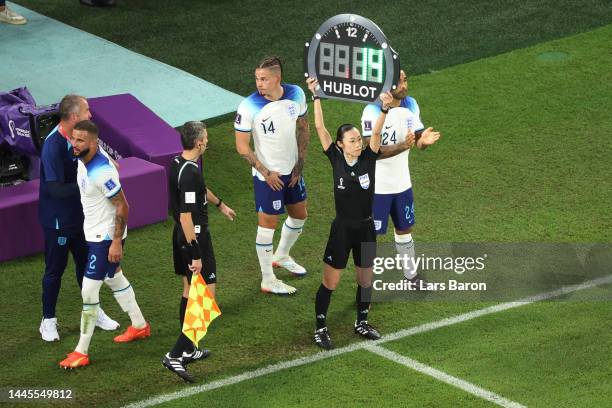 Fourth official Yoshimi Yamashita holds up the board for substitution of England during the FIFA World Cup Qatar 2022 Group B match between Wales and...