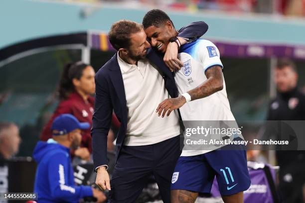 Gareth Southgate, manager of the England national football team, celebrates with Marcus Rashford of England during the FIFA World Cup Qatar 2022...