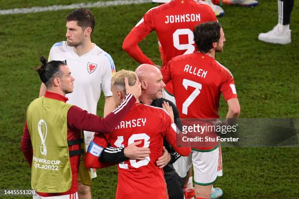 Rob Page, Head Coach of Wales, embraces Aaron Ramsey and Gareth Bale after the 3-0 win during the FIFA World Cup Qatar 2022 Group B match between...