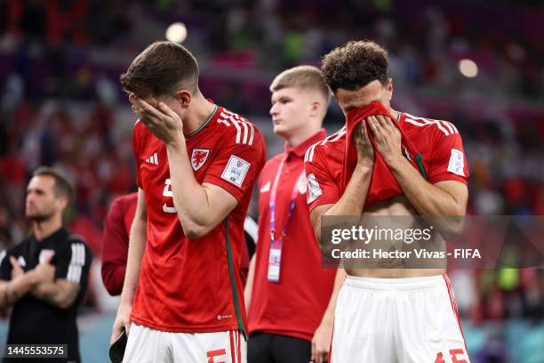 Chris Mepham and Ethan Ampadu of Wales show dejection after the 0-3 defeat in the FIFA World Cup Qatar 2022 Group B match between Wales and England...