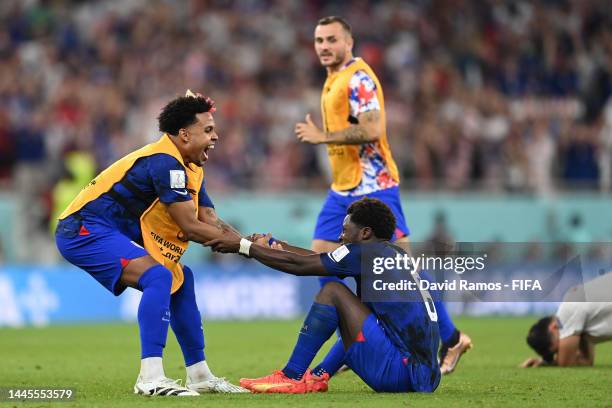 Weston McKennie celebrates with Yunus Musah of United States during the FIFA World Cup Qatar 2022 Group B match between IR Iran and USA at Al Thumama...