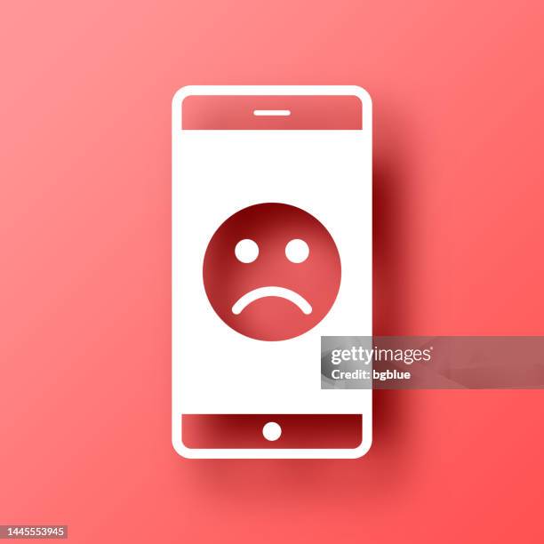 stockillustraties, clipart, cartoons en iconen met smartphone with sad emoji. icon on red background with shadow - disappointing phone