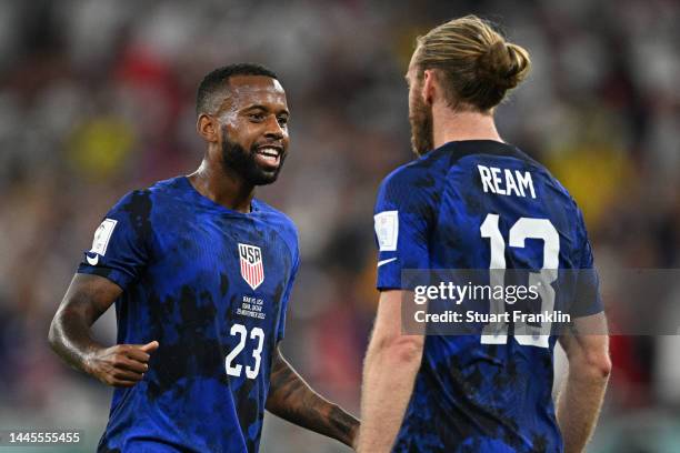 Kellyn Acosta and Tim Ream of United States celebrate after the 1-0 win during the FIFA World Cup Qatar 2022 Group B match between IR Iran and USA at...