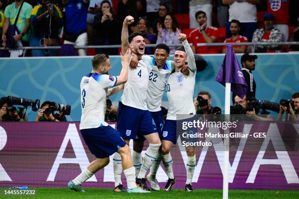 Phil Foden of England celebrates after scoring his team's second goal with Jude Bellingham and Declan Rice and Luke Shaw during the FIFA World Cup...