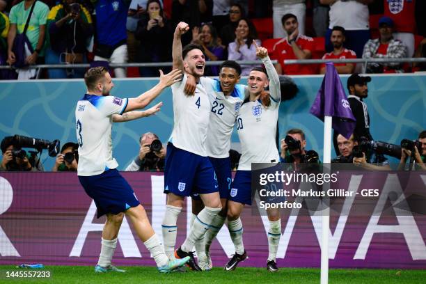 Phil Foden of England celebrates after scoring his team's second goal with Jude Bellingham and Declan Rice and Luke Shaw during the FIFA World Cup...