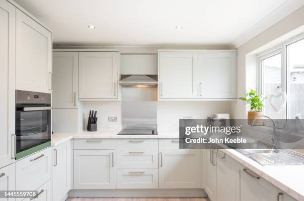 property interiors - kitchen cabinet stock-fotos und bilder