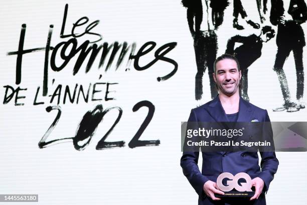 Tahar Rahim poses on stage with the 'GQ Men of the year 2022 award' during the GQ Men of the Year Awards 2022 on November 29, 2022 in Paris, France.