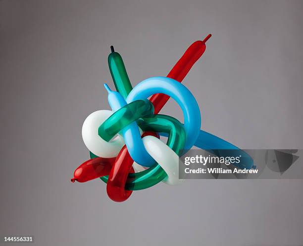 muli-color balloons tied in giant knot - tied knot imagens e fotografias de stock