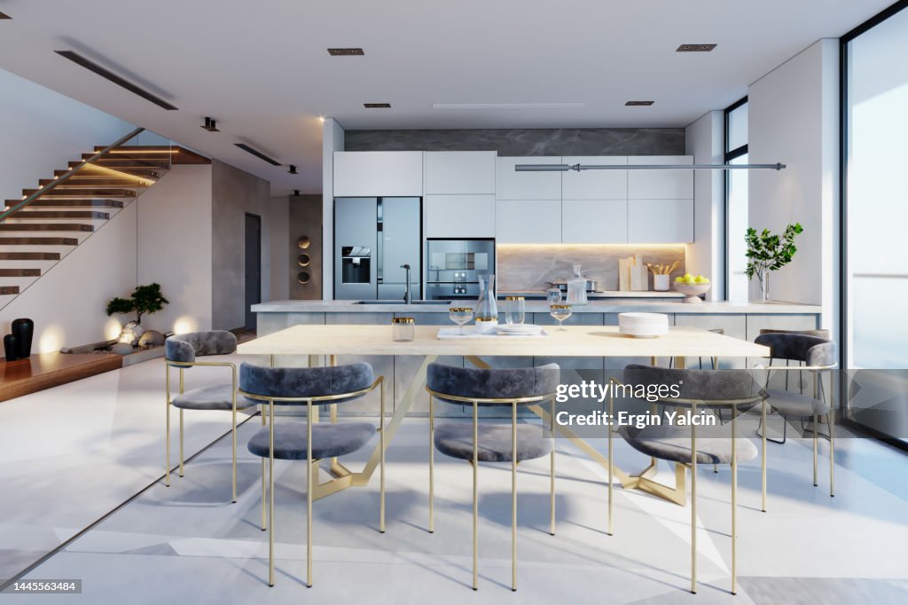 Luxury Home Interior With Staircase, Refrigerator And Dining Table