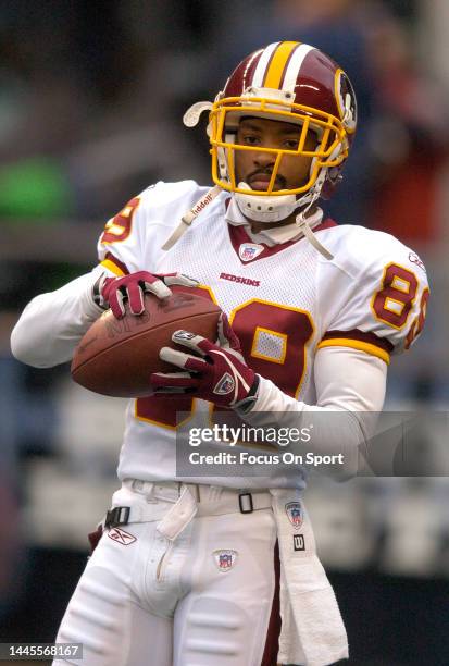 Santana Moss of the Washington Redskins warms up during pregame warm ups prior to playing the Seattle Seahawks in the NFC divisional playoff game on...