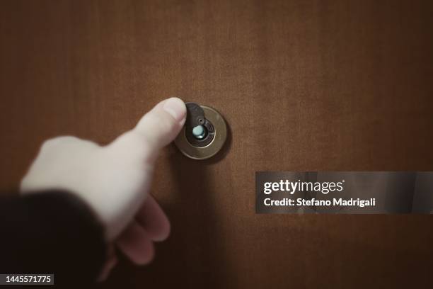 spy on the door - looking through hole stock pictures, royalty-free photos & images