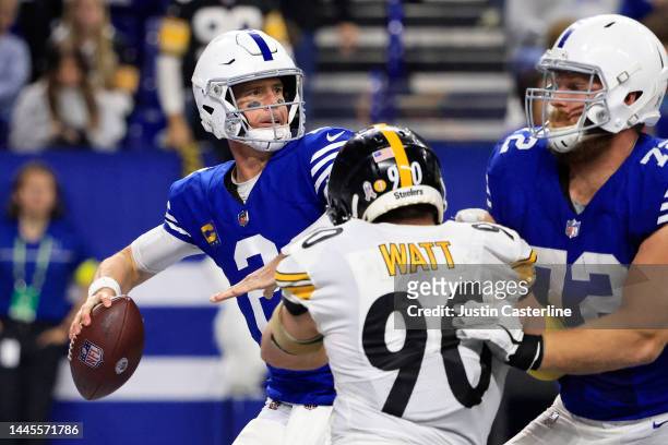 Matt Ryan of the Indianapolis Colts throws the ball while being pressured by T.J. Watt of the Pittsburgh Steelers at Lucas Oil Stadium on November...