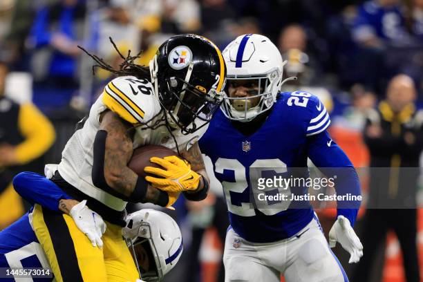 Anthony McFarland Jr. #26 of the Pittsburg Steelers is tackled by Rodney McLeod of the Indianapolis Colts at Lucas Oil Stadium on November 28, 2022...