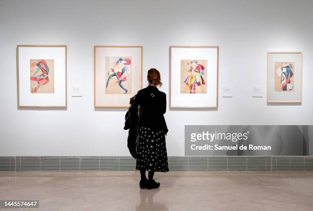 Visitor looks at paintings during the Avant-Garde Ucranian Art Exhibition at Thyssen Museum on November 29, 2022 in Madrid, Spain.