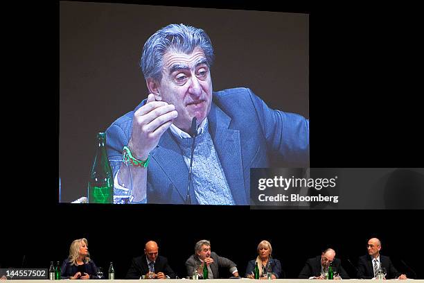 Marc Hayek, head of Swatch Group AG's Blancpain brand, center left, and Nayla Hayek, chairwoman of Swatch Group AG, center right, listen as Nick...