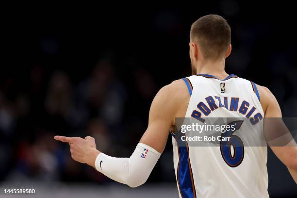 Kristaps Porzingis of the Washington Wizards celebrates against the Minnesota Timberwolves at Capital One Arena on November 28, 2022 in Washington,...