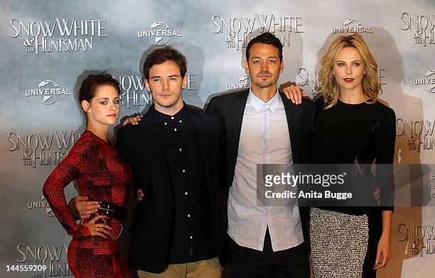 Actress Kristen Stewart, actor Sam Claflin, director Rupert Sanders and actress Charlize Theron attend the 'Snow White And The Huntsman' photocall at...