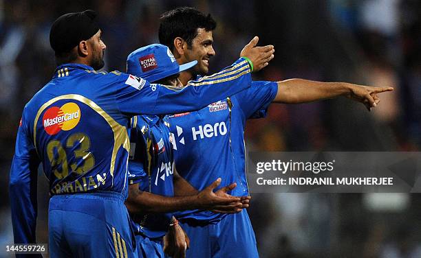 Mumbai Indians captain Harbhajan Singh alongwith bowlers Lasith Malinga and Rudra Pratap Singh make a fielding change during the IPL Twenty20 cricket...