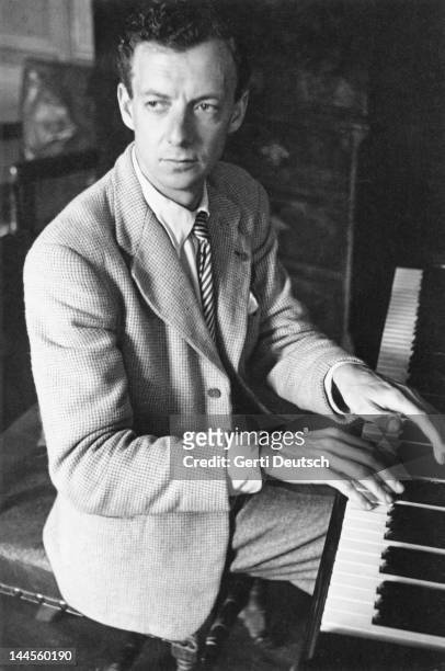 English composer and pianist Benjamin Britten rehearsing his opera 'The Rape Of Lucretia' in the organ room at the Glyndebourne opera festival, 1946....