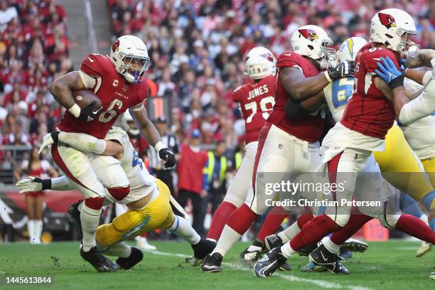 Running back James Conner of the Arizona Cardinals rushes the football against the Los Angeles Chargers during the NFL game at State Farm Stadium on...