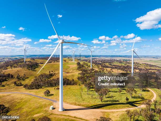 wind farm out in a paddock. - turbine generator stock pictures, royalty-free photos & images