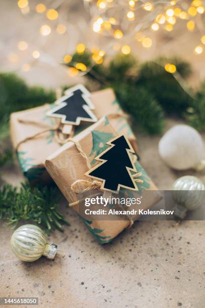 zero waste christmas concept. wrapped gift boxes from craft wrapping paper with christmas decoration. place for text - plastic free stock pictures, royalty-free photos & images