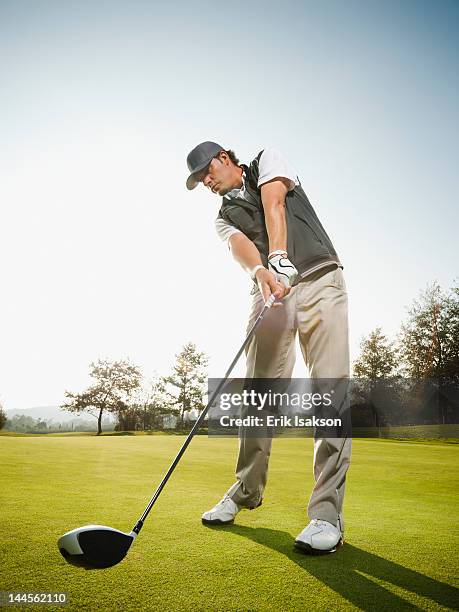 usa, california, mission viejo, low angle view of man playing golf - golfschwung stock-fotos und bilder