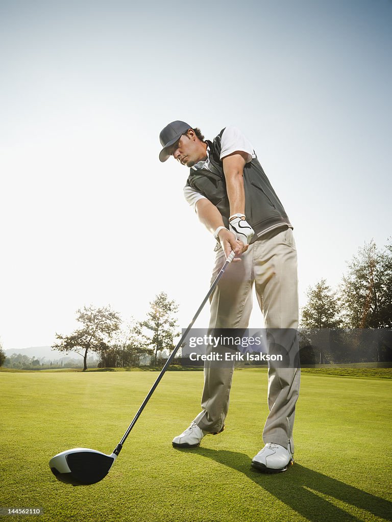 USA, California, Mission Viejo, Low angle view of man playing golf