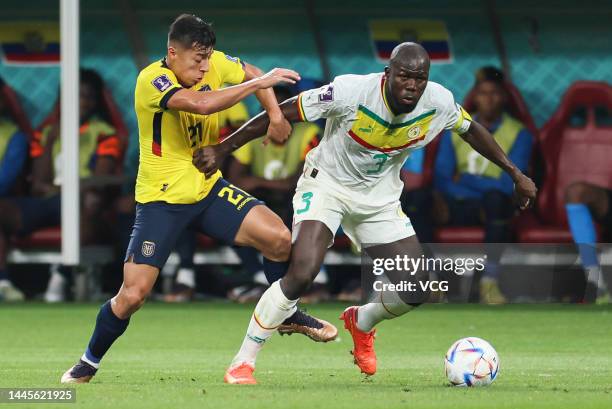 Alan Franco of Ecuador and Kalidou Koulibaly of Senegal compete for the ball during the FIFA World Cup Qatar 2022 Group A match between Ecuador and...